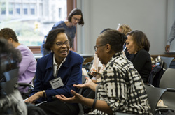 Photograph of Sheryl Harrison (l) and Daryl Sherman (r) at Modern School multigenerational reunion