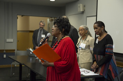 Photograph of [SINGER NAME] performing Lift Ev'ry Voice at Modern School multigenerational reunion