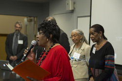 Photograph of [SINGER NAME] performing Lift Ev'ry Voice at Modern School multigenerational reunion