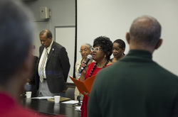 Photograph of [SINGER NAME] performing Lift Ev'ry Voice at Modern School multigenerational reunion