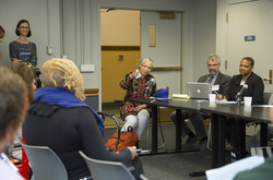 Photograph of Melanie Edwards speaking on the panel at Modern School multigenerational reunion