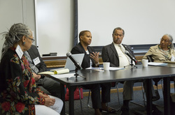 Photograph of Deidre B. Flowers speaking on the panel at Modern School multigenerational reunion