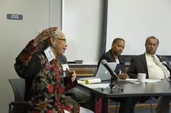 Photograph of Melanie Edwards speaking on the panel at Modern School multigenerational reunion