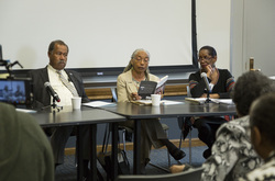 Photograph of Juanita Coleman Merritt reading from her book on the panel at Modern School multigenerational reunion
