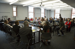 Photograph of panel discussion at Modern School multigenerational reunion